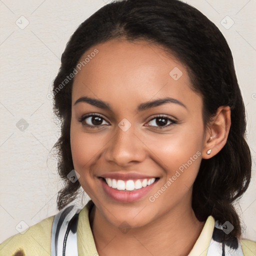 Joyful latino young-adult female with medium  brown hair and brown eyes