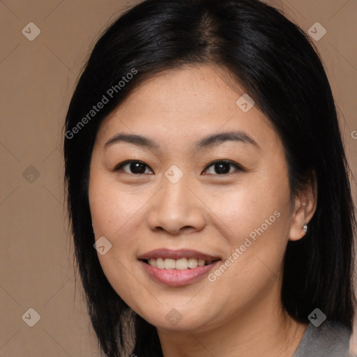 Joyful asian young-adult female with long  black hair and brown eyes