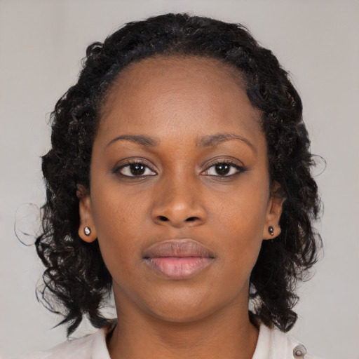 Neutral black young-adult female with medium  black hair and brown eyes