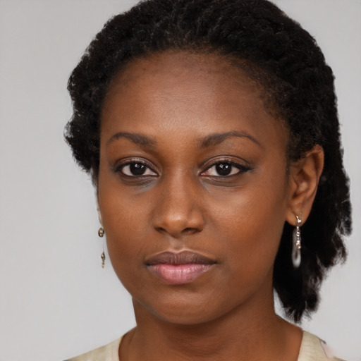 Neutral black young-adult female with medium  black hair and brown eyes