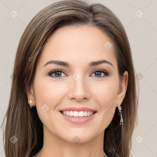 Joyful white young-adult female with long  brown hair and grey eyes