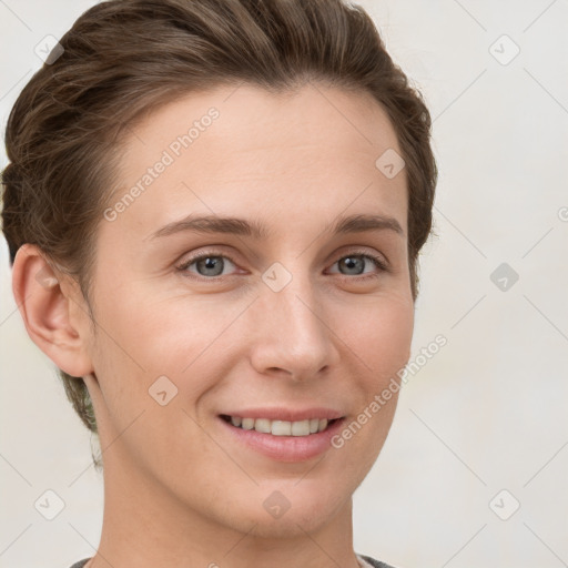 Joyful white young-adult female with short  brown hair and grey eyes