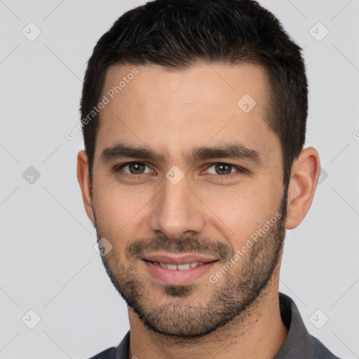 Joyful white young-adult male with short  brown hair and brown eyes