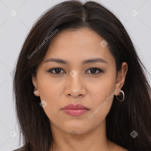 Joyful latino young-adult female with long  brown hair and brown eyes