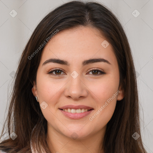 Joyful white young-adult female with long  brown hair and brown eyes