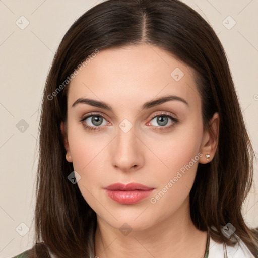 Neutral white young-adult female with long  brown hair and brown eyes