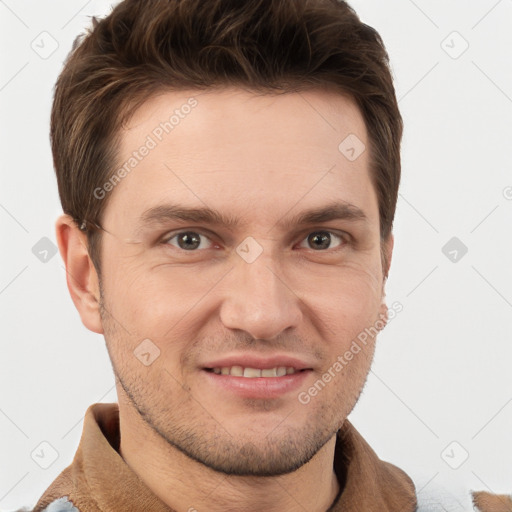 Joyful white young-adult male with short  brown hair and grey eyes