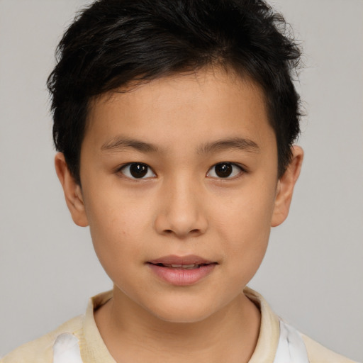 Joyful white child male with short  brown hair and brown eyes