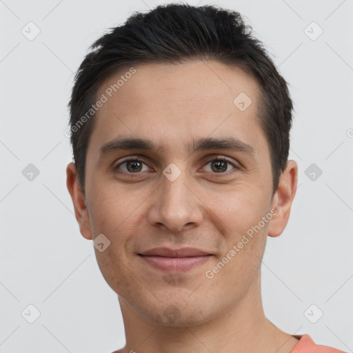 Joyful white young-adult male with short  brown hair and brown eyes