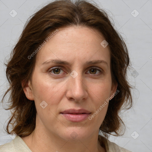 Joyful white adult female with medium  brown hair and grey eyes