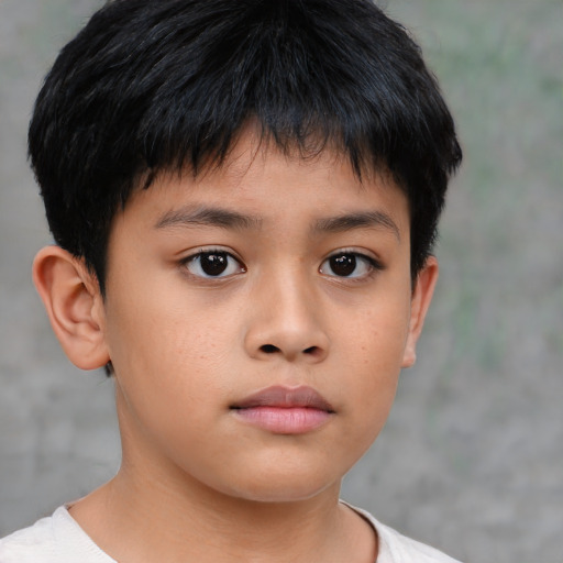 Neutral asian child male with short  brown hair and brown eyes