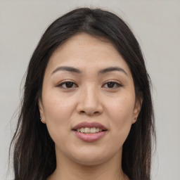 Joyful white young-adult female with long  brown hair and brown eyes