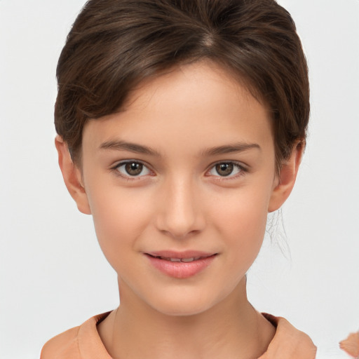 Joyful white child female with short  brown hair and brown eyes