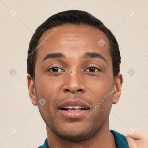 Joyful white young-adult male with short  black hair and brown eyes