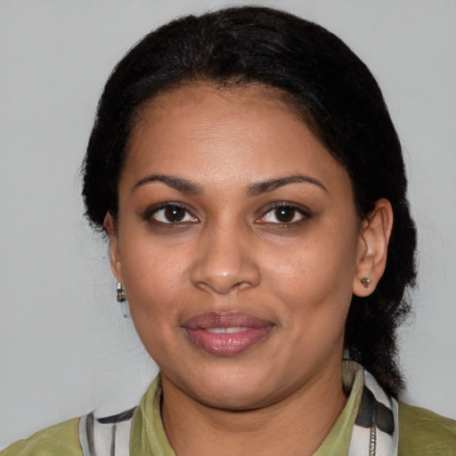 Joyful white young-adult female with medium  black hair and brown eyes