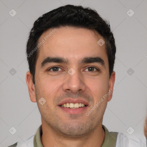 Joyful white young-adult male with short  black hair and brown eyes