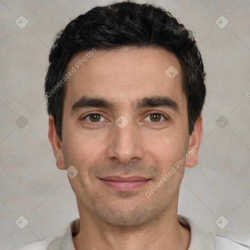 Joyful white young-adult male with short  black hair and brown eyes