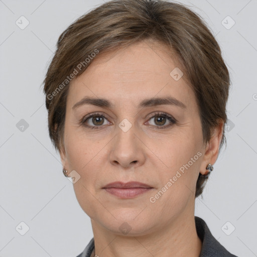 Joyful white adult female with short  brown hair and grey eyes