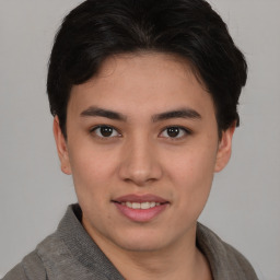 Joyful asian young-adult female with short  brown hair and brown eyes