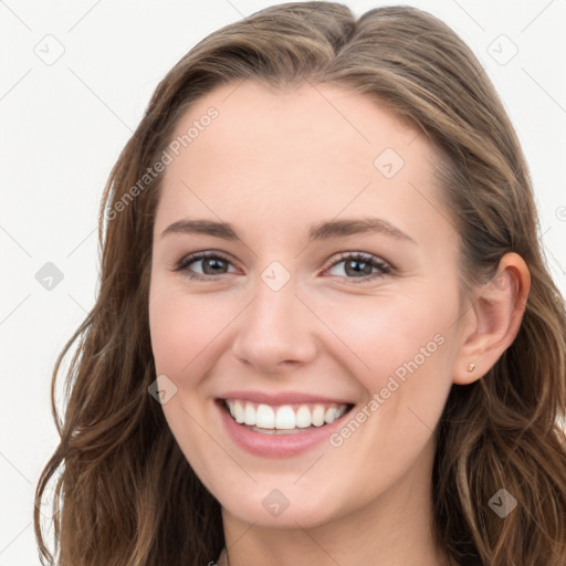 Joyful white young-adult female with long  brown hair and blue eyes