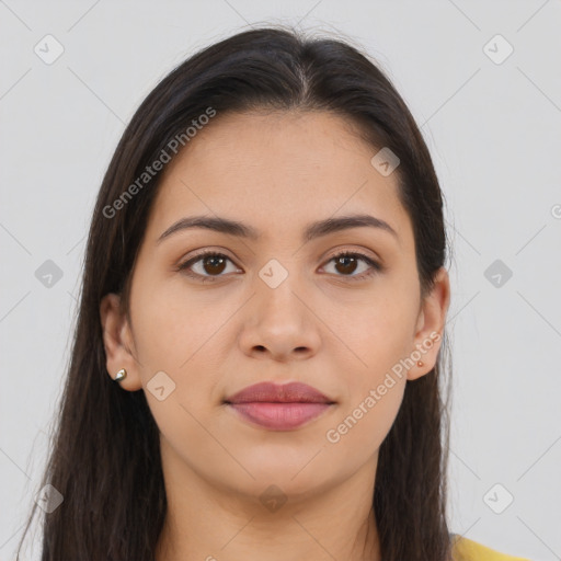 Joyful latino young-adult female with long  brown hair and brown eyes