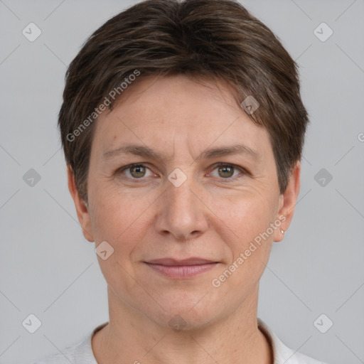 Joyful white adult female with short  brown hair and grey eyes