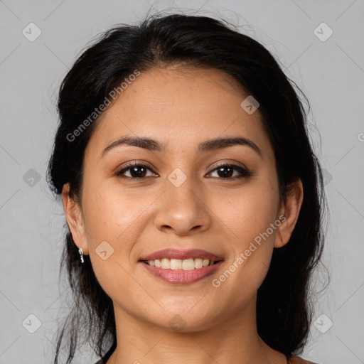 Joyful latino young-adult female with medium  brown hair and brown eyes