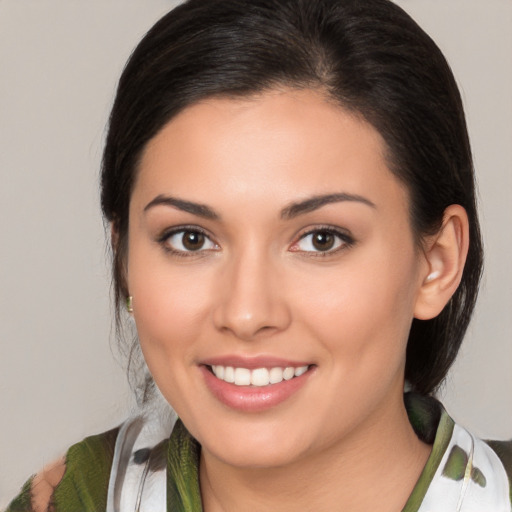 Joyful white young-adult female with medium  brown hair and brown eyes