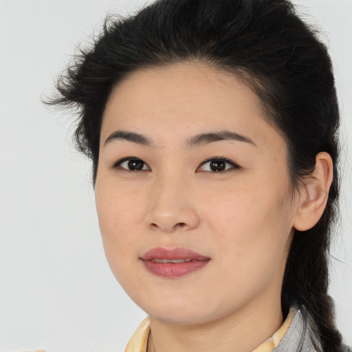 Joyful asian young-adult female with medium  brown hair and brown eyes