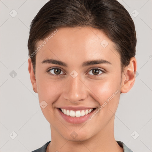 Joyful white young-adult female with short  brown hair and brown eyes