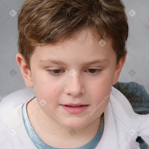 Joyful white child male with short  brown hair and brown eyes