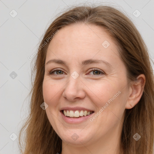 Joyful white adult female with long  brown hair and grey eyes