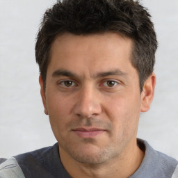 Neutral white adult male with short  black hair and brown eyes
