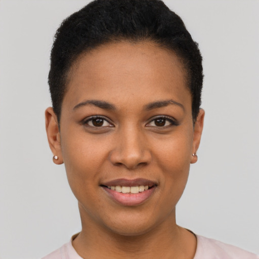Joyful latino young-adult female with short  black hair and brown eyes