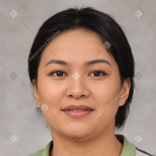 Joyful latino young-adult female with medium  brown hair and brown eyes