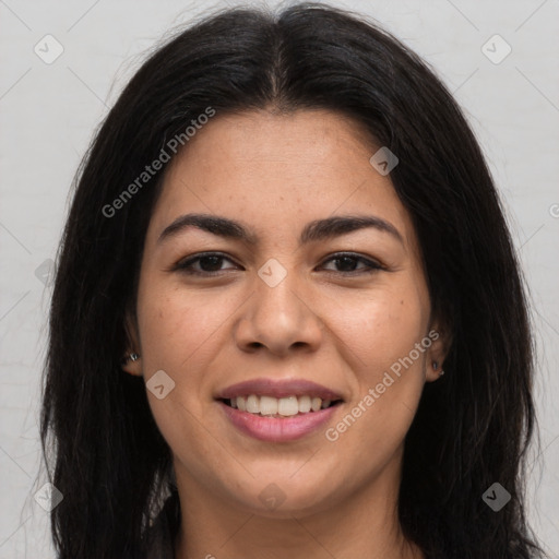 Joyful latino young-adult female with long  brown hair and brown eyes