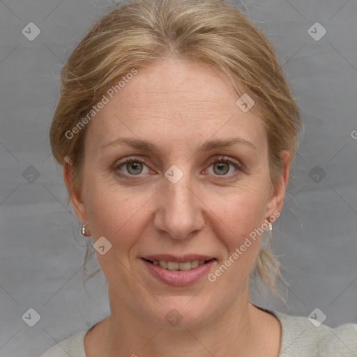 Joyful white adult female with medium  brown hair and blue eyes