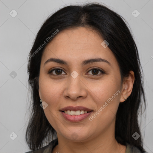 Joyful latino young-adult female with long  brown hair and brown eyes