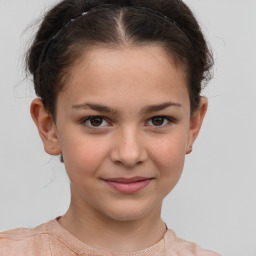 Joyful white child female with short  brown hair and brown eyes