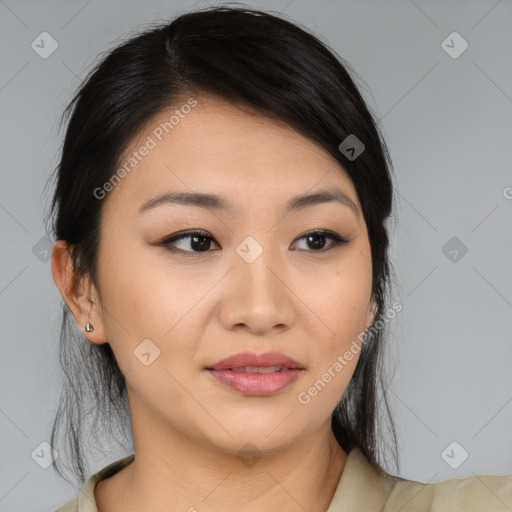 Joyful asian young-adult female with medium  black hair and brown eyes