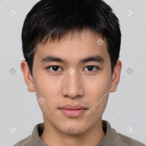 Neutral asian young-adult male with short  brown hair and brown eyes