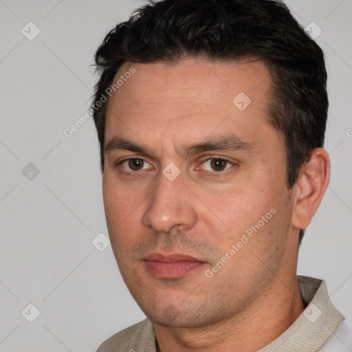 Joyful white adult male with short  brown hair and brown eyes