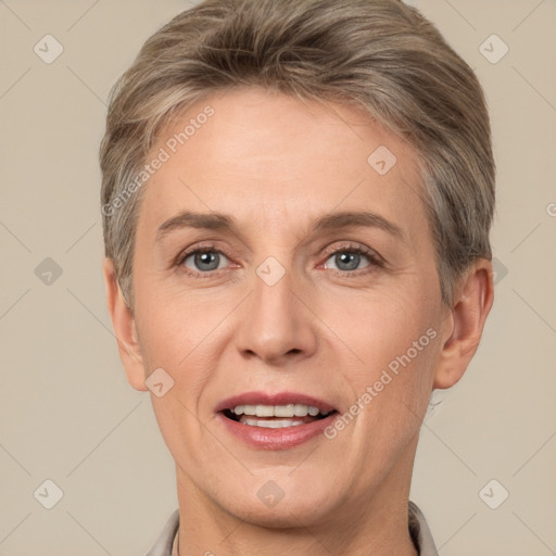 Joyful white adult female with short  brown hair and brown eyes