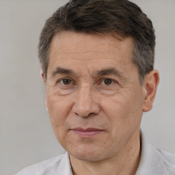 Joyful white middle-aged male with short  brown hair and brown eyes