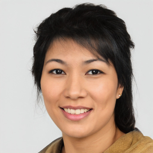 Joyful asian young-adult female with short  brown hair and brown eyes