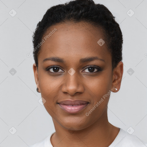 Joyful black young-adult female with short  black hair and brown eyes