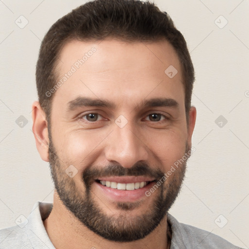 Joyful white young-adult male with short  brown hair and brown eyes