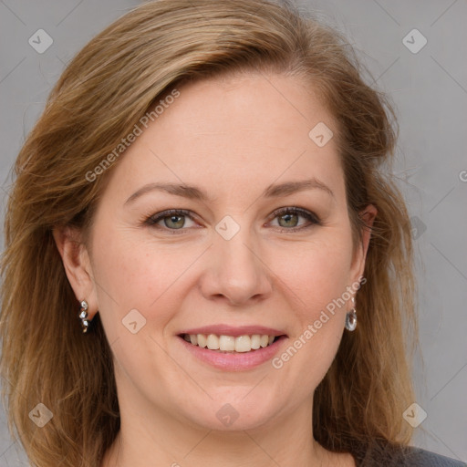 Joyful white adult female with long  brown hair and grey eyes