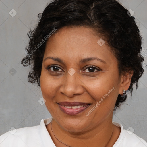 Joyful black adult female with short  brown hair and brown eyes