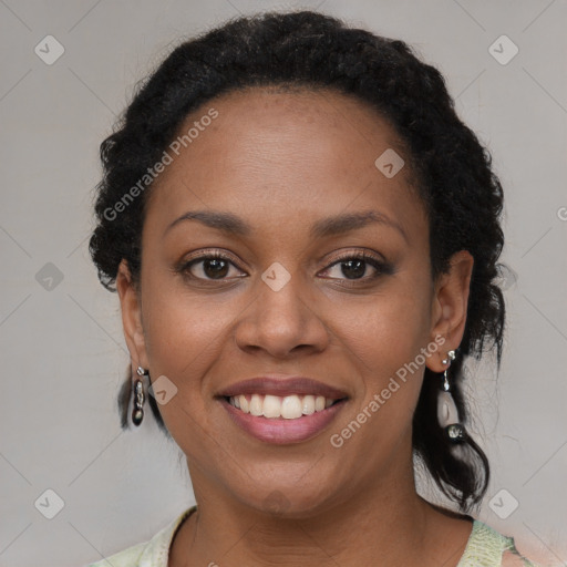 Joyful black young-adult female with short  brown hair and brown eyes